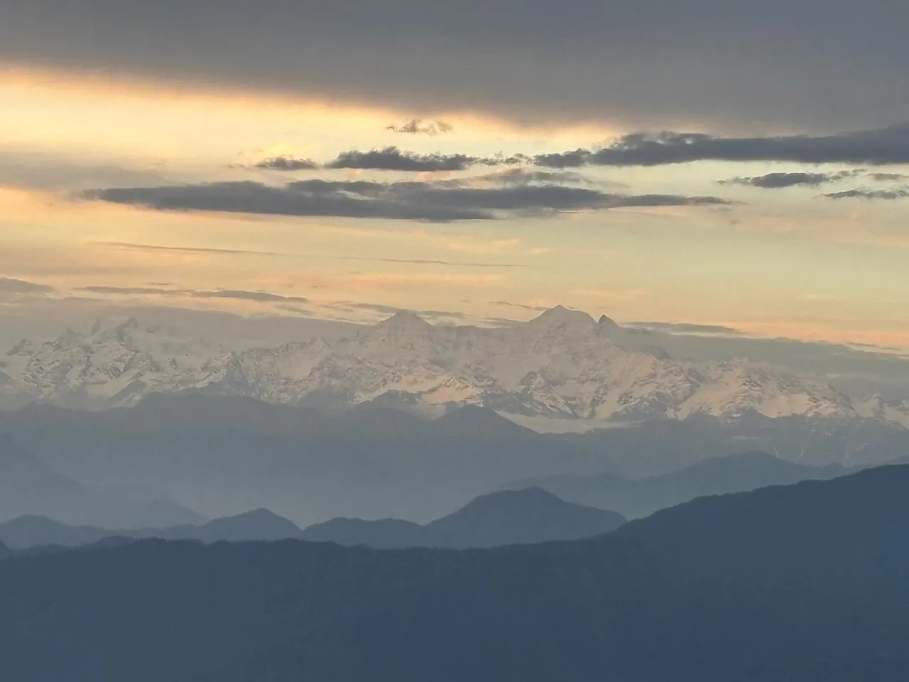 First light on the Himalayan snow peaks seen from Namah Stay Himalayas, Kanatal